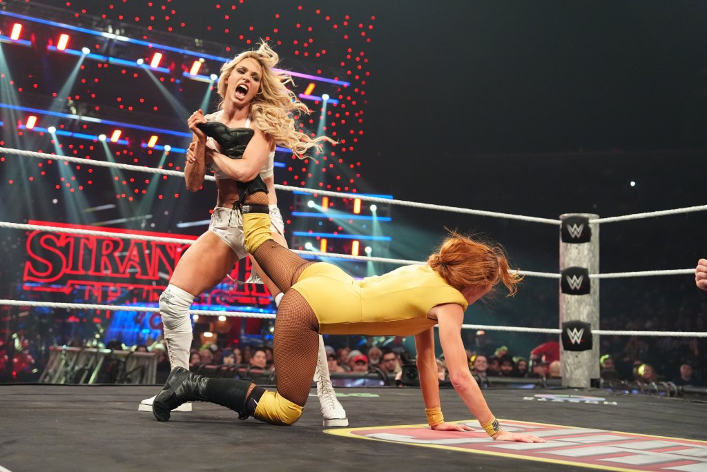 Maxxine Dupri has Becky Lynch in an ankle lock 