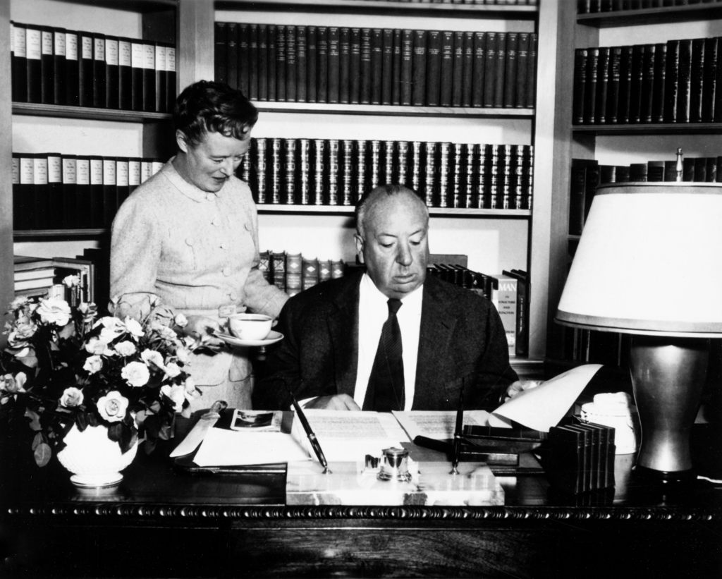 VERTIGO, director Alfred Hitchcock, with his wife, Alma Reville, working on the script, 1958