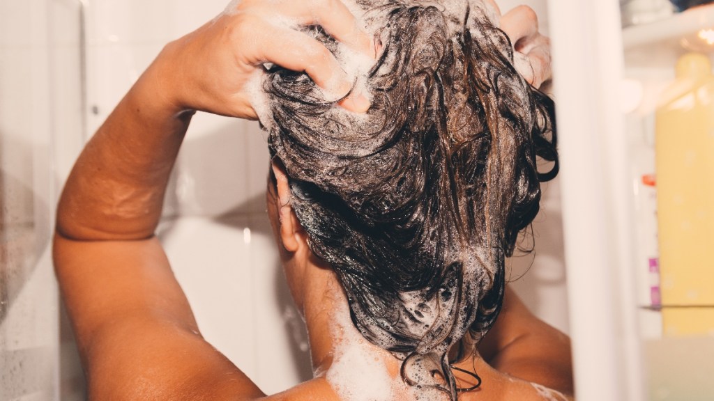 Woman washing her hair in the shower.