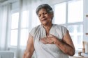 Senior woman feeling chest pain due to heart palpitations