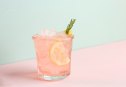 Pink Alcoholic Rose Lemon Beverage or Lemonade, Cocktail with Rosemary and Lemon Slice for sober curious people