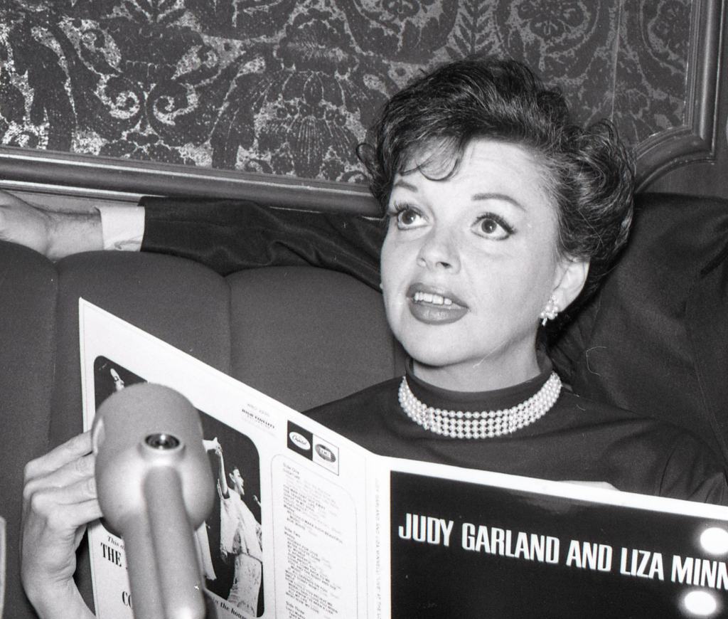 Original caption: Judy Garland and husband Mark Herron are interviewed, August 1965 Garland is in town to perform several shows at the Circle Star Theater