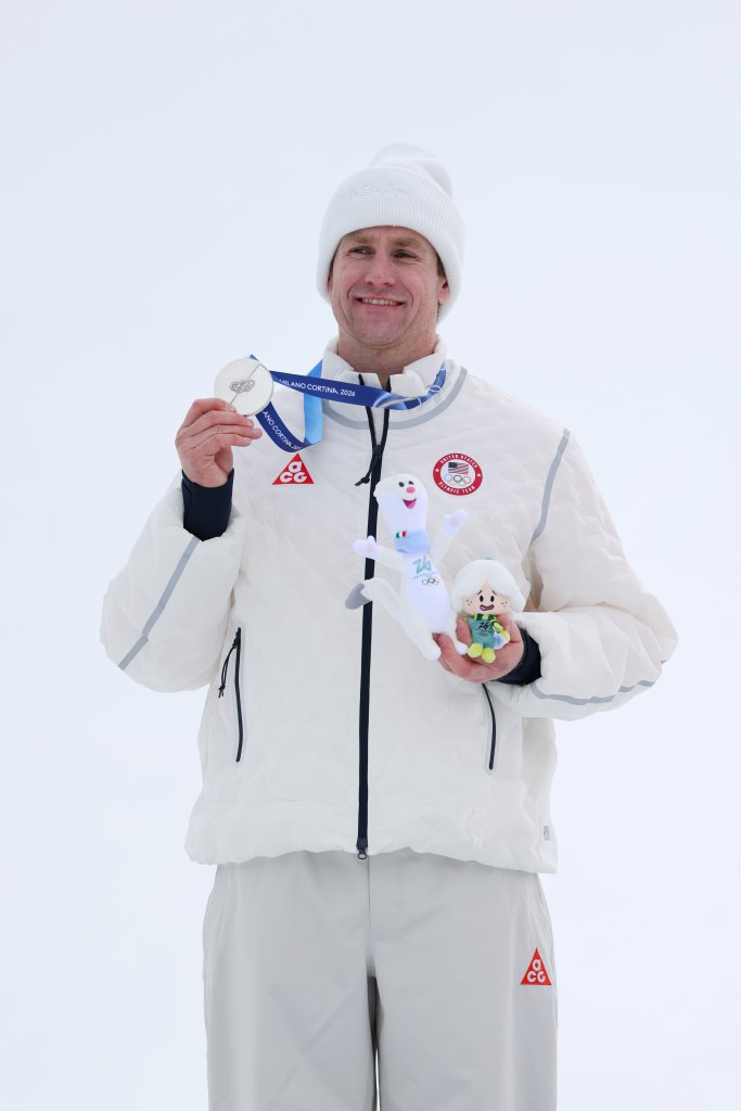 Ryan Cochran-Siegle poses with his silver medal at the Winter Olympics on February 11, 2026—exactly 54 years after his mom, Barbara Cochran, won gold in 1972