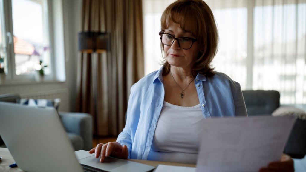 Senior woman working at home