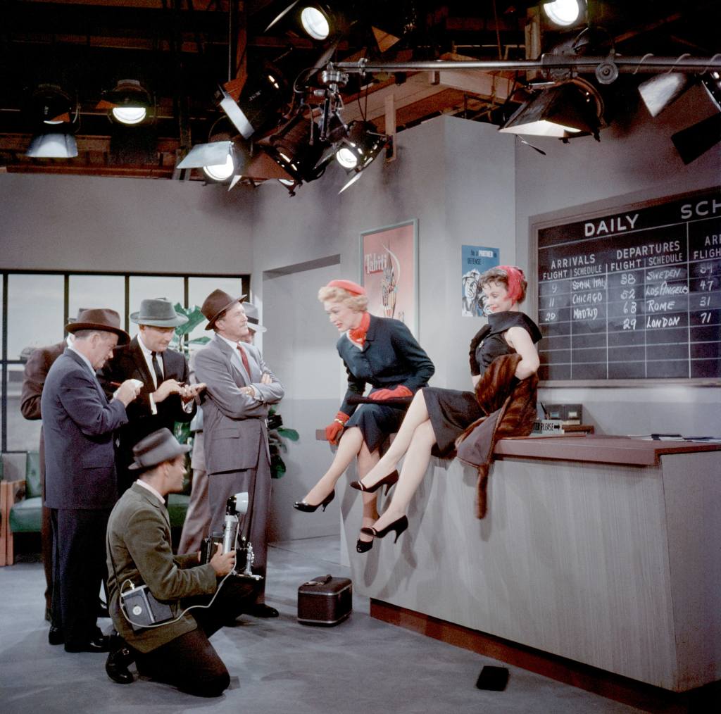 THE EVE ARDEN SHOW, Allyn Joslyn (in gray suit, with arms crossed), Eve Arden (center), on set, during production at Desilu Studios, Los Angeles, California, episode unknown, 1957-1958.