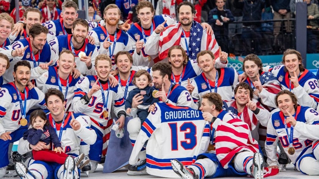 Team USA with two of Johnny Gaudreau's children at the 2026 Winter Olympics