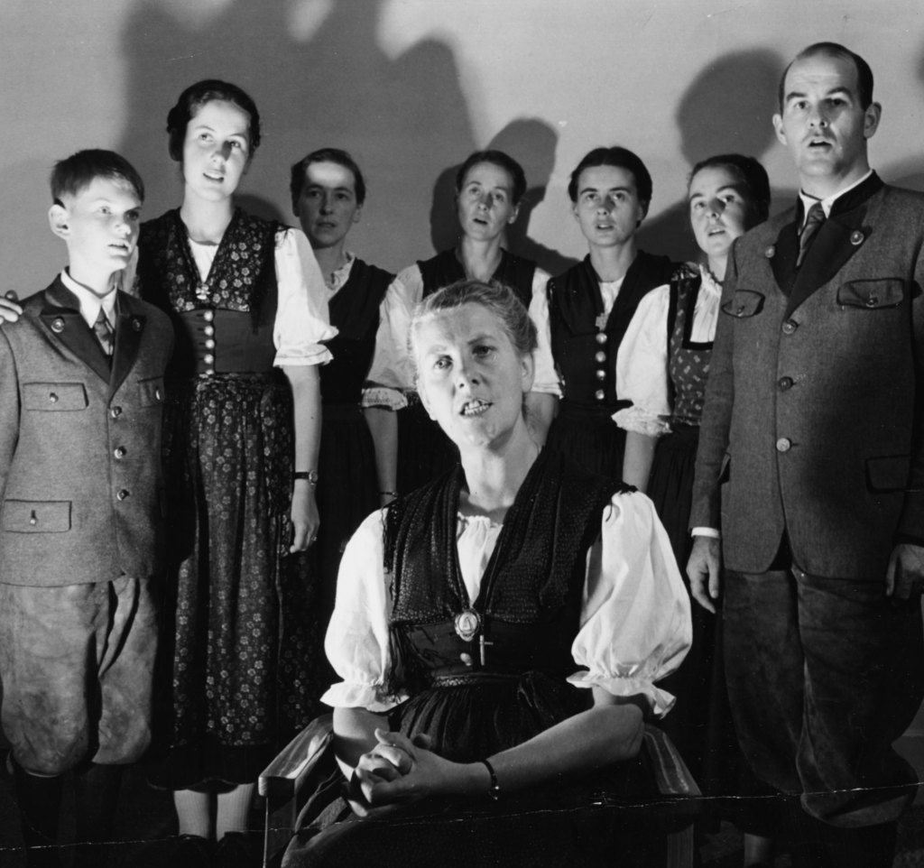 Maria von Trapp (seated) with her children (left to right): Johannes, Eleonore, Hedwig, Martina, Maria, Rosemarie and Werner, in 1950, the year Trapp Family Lodge opened