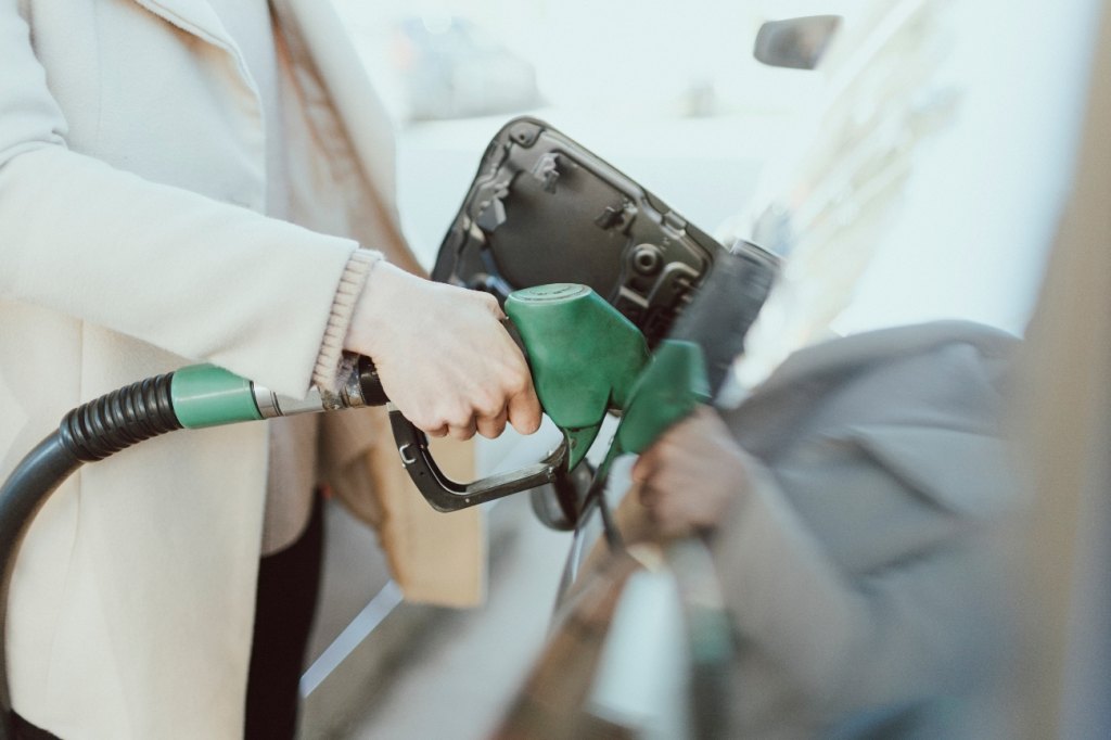 Woman at a gas pump