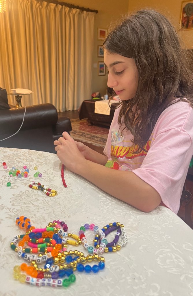 Darya loves making bracelets to raise money for homeless shelters