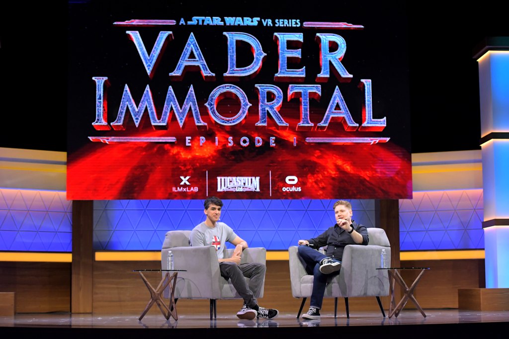 Mohen Leo and Bryan Bishop speak onstage at the Vader Immortal: Discover the Dark Side panel during E3 2019 at the Novo Theatre on June 12, 2019 in Los Angeles, California.