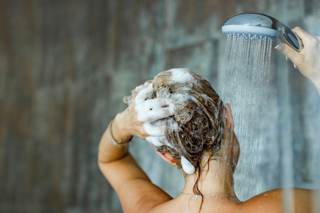 woman shampooing hair