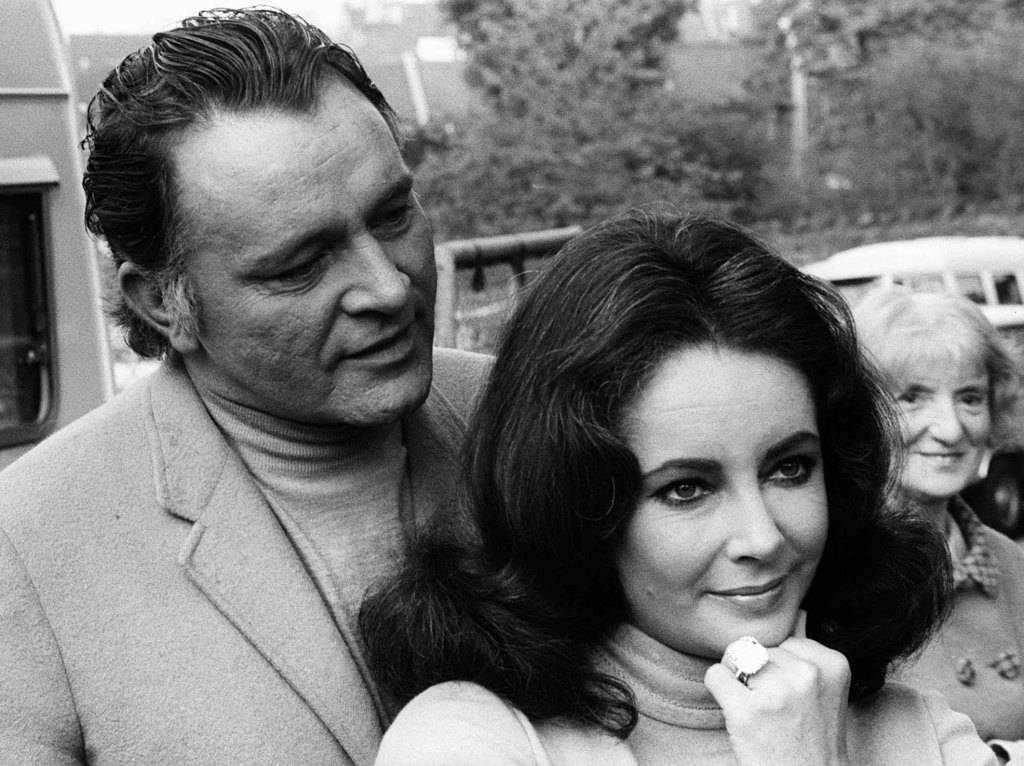 Elizabeth Taylor with Richard Burton showing off her diamond ring in May 1968