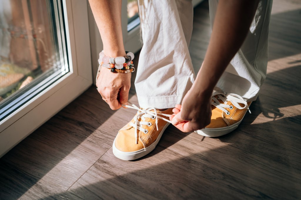 woman tying shoes