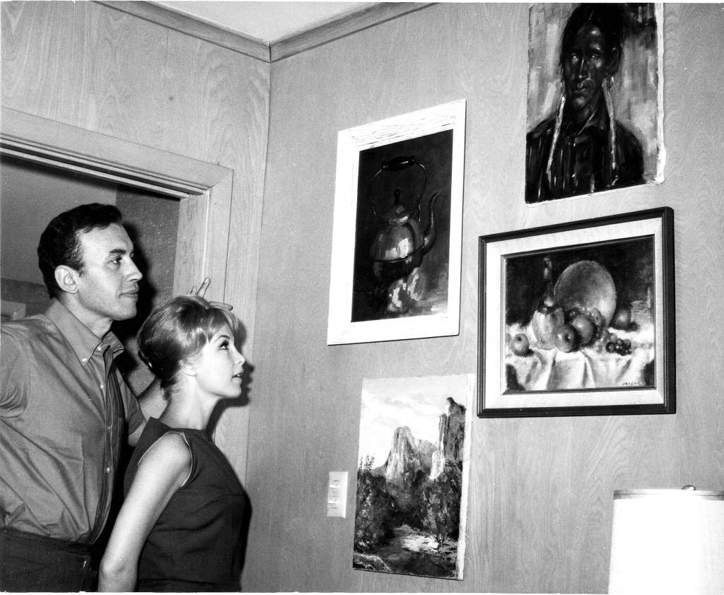 Barbara Eden, with her first husband, actor Michael Ansara, in their Studio City home, ca. mid-1960s (paintings are by Ansara)