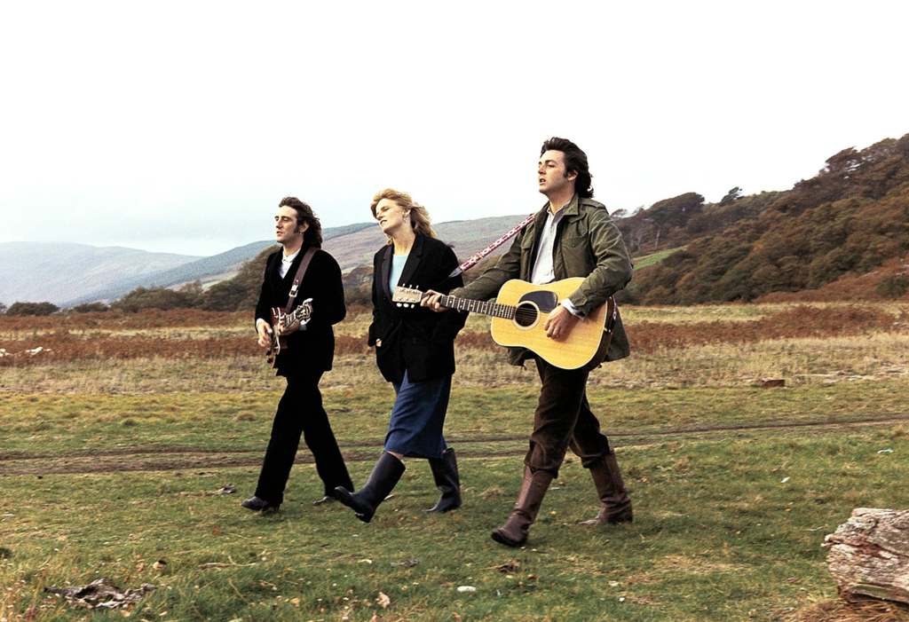 Paul and Linda McCartney in the countryside with their Wings bandmate Denny Laine