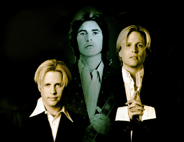 The Nelson brothers pose with a portrait of their dad in 1999