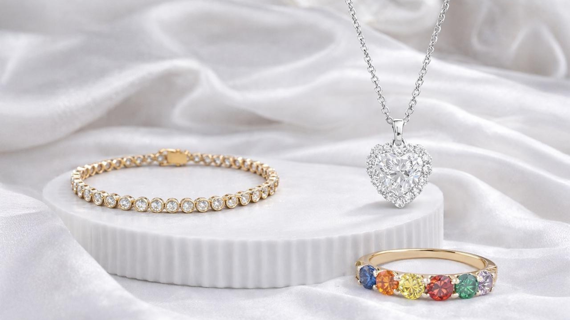 lab grown diamonds tennis bracelet, halo pendant necklace, and rainbow wedding ring for women