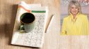 A cup of coffee on top of a newspaper with brain games, and Martha Stewart in an inset photo