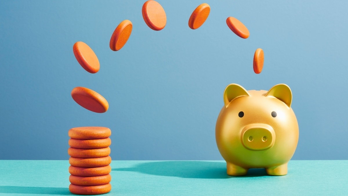 illustration of a stack of orange coins leaping one by one into a gold piggy bank