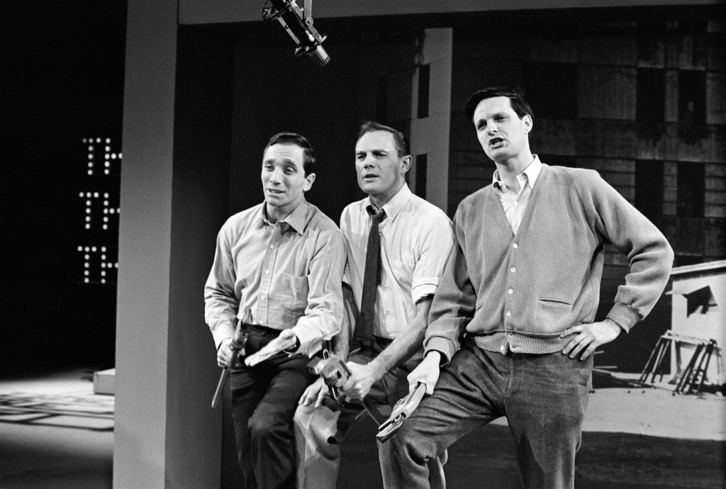 THAT WAS THE WEEK THAT WAS -- Pictured: (l-r) Sandy Baron, Stanley Grover, Alan Alda 
