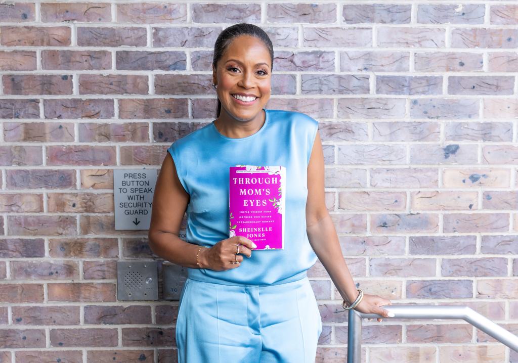 Sheinelle Jones holding a copy of her book, 'Through Mom's Eyes,' 2026