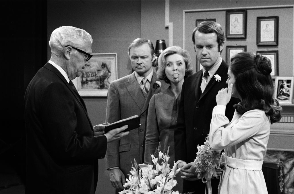 DAYS OF OUR LIVES -- "Scott Banning and Julie Olson Wedding" -- Season:5 -- Pictured: (l-r) unknown extra as minister, John Clarke as Mickey Horton, Susan Flannery as Dr. Laura Ann Spencer Horton, Mike Farrell as Scott Banning, Susan Seaforth Hayes as Julie Olson -- 