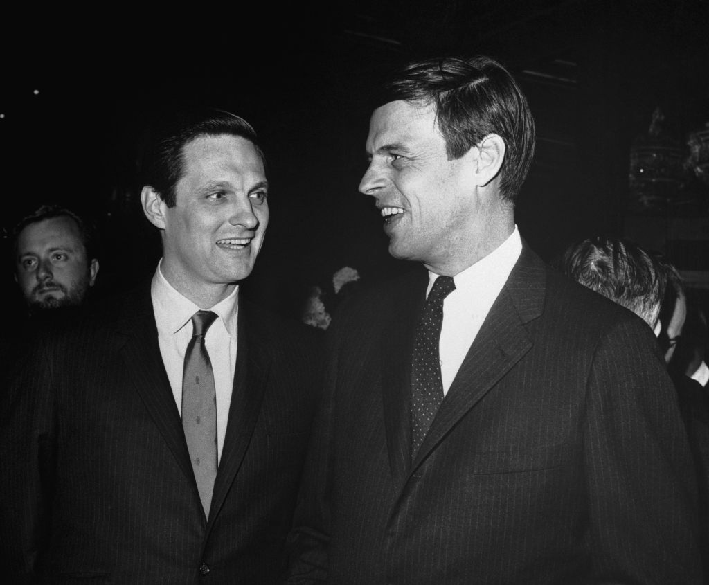 (Original Caption) 12/9/1967- Author-athlete George Plimpton (R) with actor Alan Alda at a party honoring Plimpton. Alda is to portray Plimpton in a movie based on the book, "The Paper Lion".