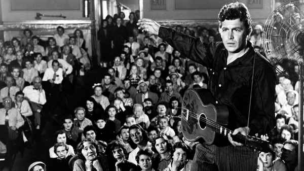 Andy Griffith playing the guitar in the 1957 film 'A Face in the Crowd.'