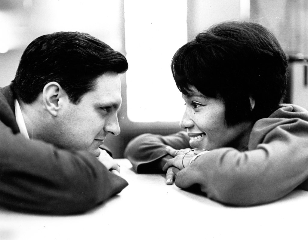 Actors Alan Alda (left) and Diana Sands stare at one another in a scene from the Broadway production of 'The Owl and the Pussycat,' New York, New York, 1965. 