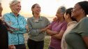 Group of women smiling and socializing to help prevent dementia