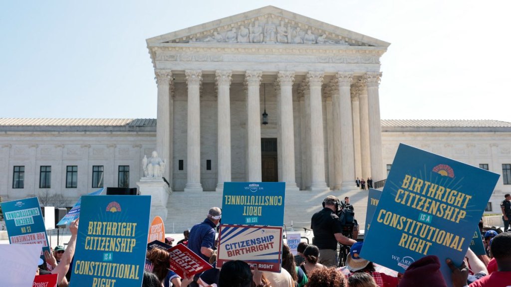 Protesters stand outside the Supreme Court building to fight for birthright citizenships