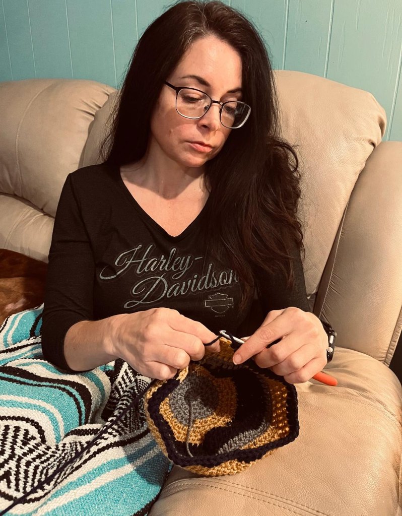 Cynthia crochets hats for cancer patients