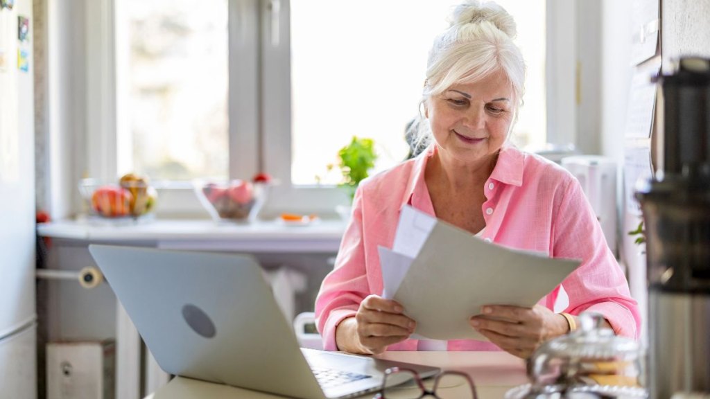 older woman looking at her bank account