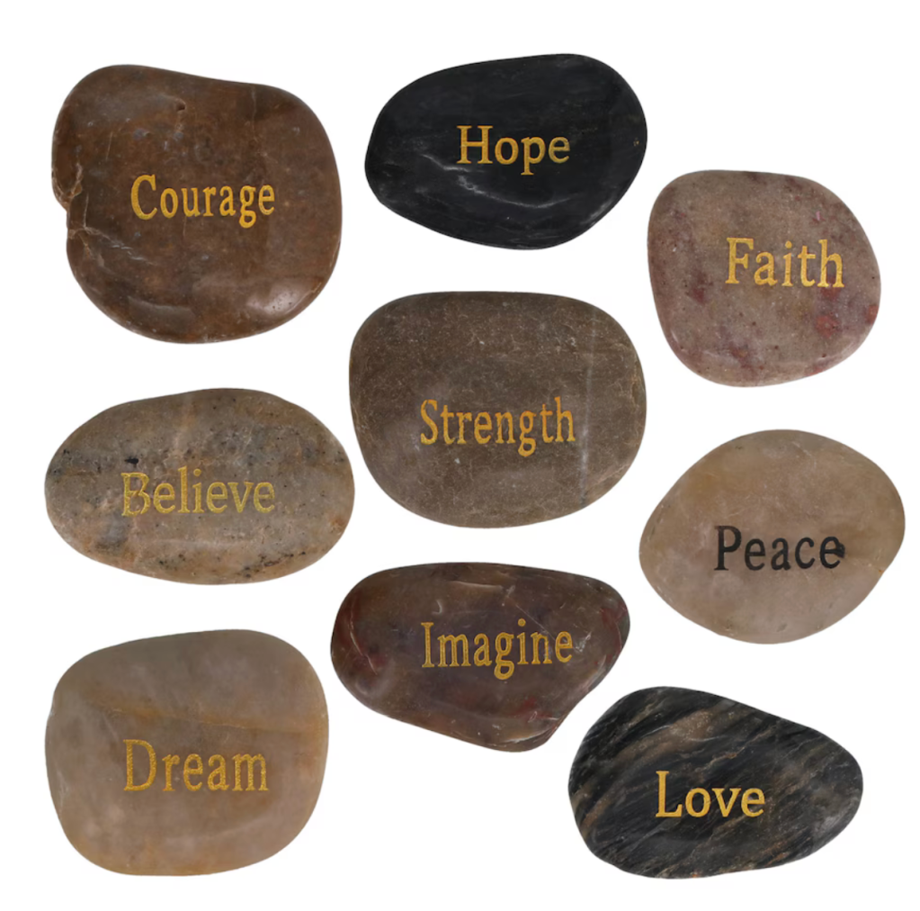assorted river rocks inspired with inspirational words like courage or faith