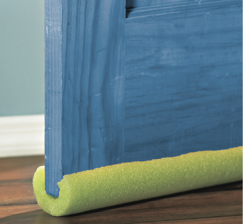 A door with a pool noodle cut to fit along the bottom