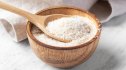 close-up of psyllium husk, the best fiber supplement to lower cholesterol, in a wooden bowl