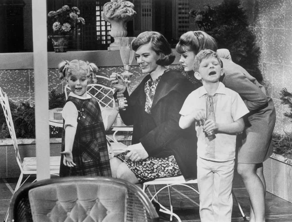 (Original Caption) Diane Brewster (second from left) tries to make friends with Anissa Jones, Kathy Garver, and Johnnie Whitaker (left to right) in a scene from the TV series, Family Affair. 1967.