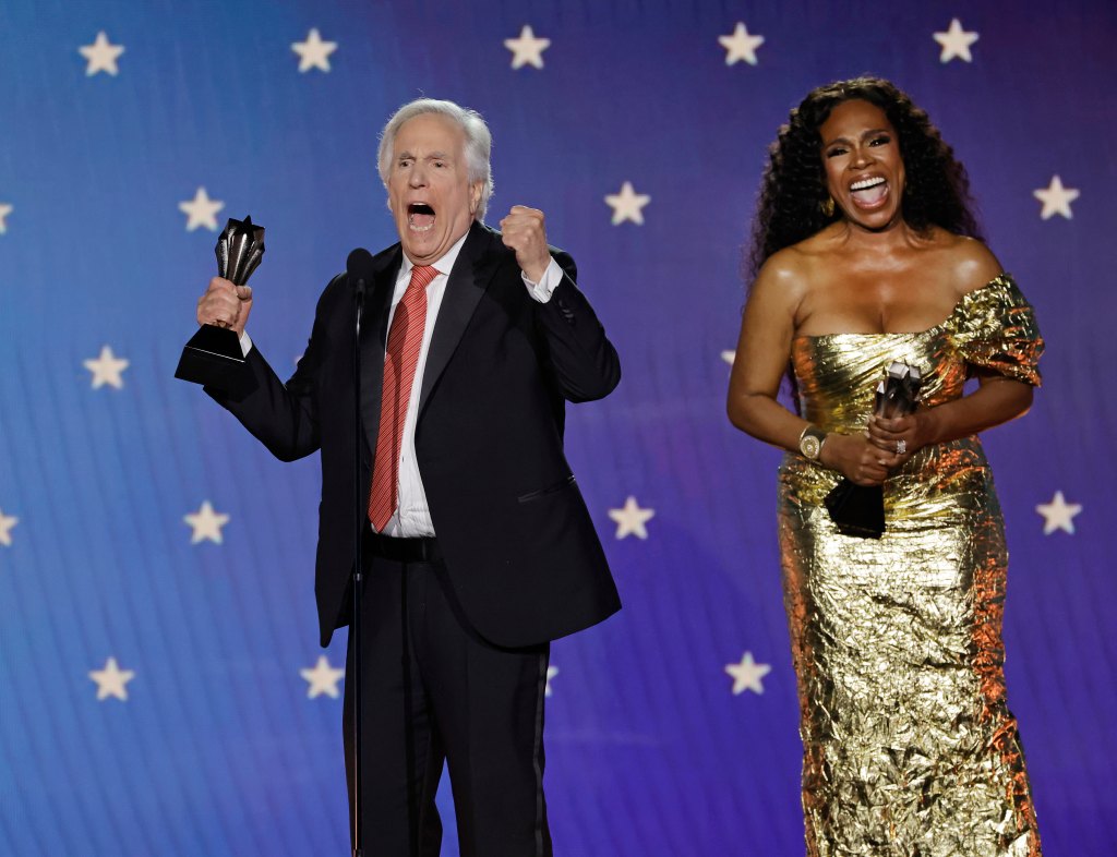 Actor Henry Winkler accepts his Critics Choice Award in 2023 from Sheryl Lee Ralph.