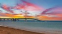A beautiful scenic view of Michigan's Mackinac Bridge at sunset.