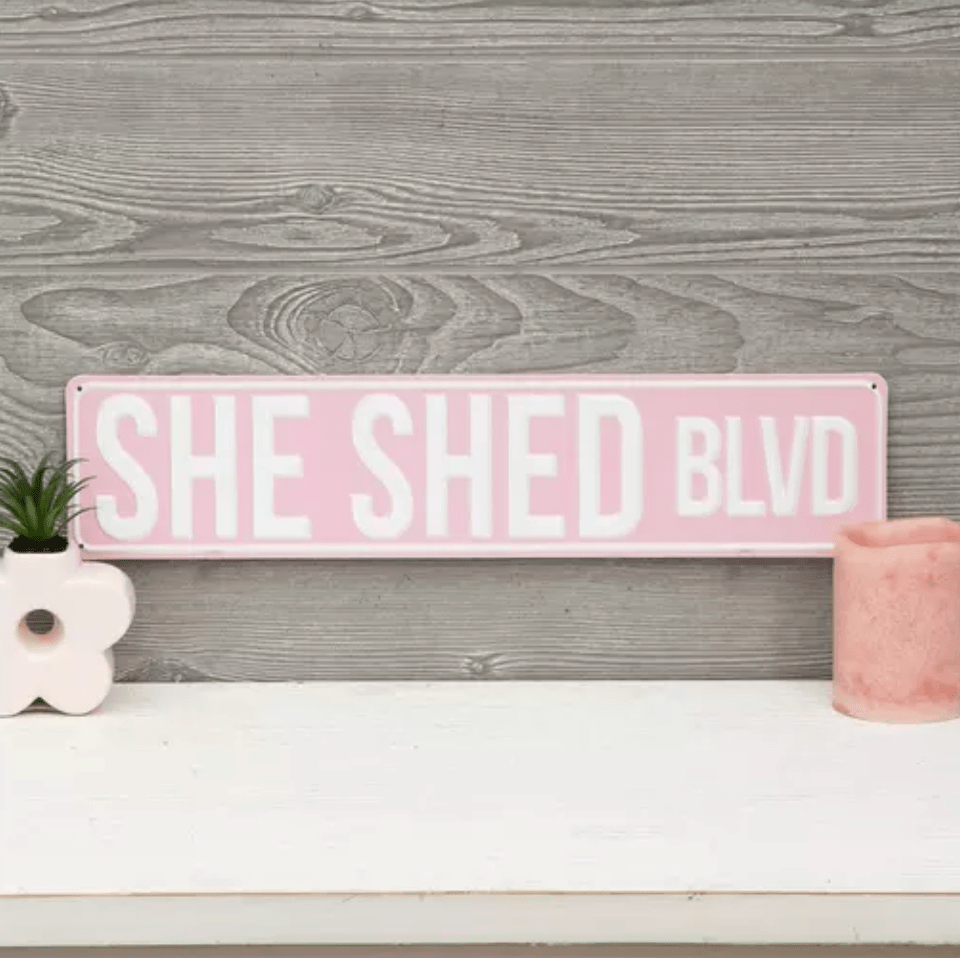 She shed sign