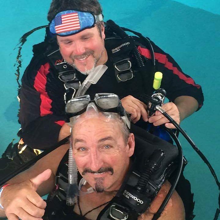 Charley (above) helping quadriplegic Steve Miller
