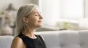 Older woman breathing deeply to activate her vagus nerve to clear her brain fog
