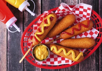 Dip a hot dog completely into the batter. Carefully place battered hot dog into the hot oil sideways so the hot dog and stick are in the oil. Cook for 3-4 minutes, turning the doing bard wring for each of dog: s the rand wandesire i ping at reat,