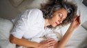 A woman taking a nap in bed