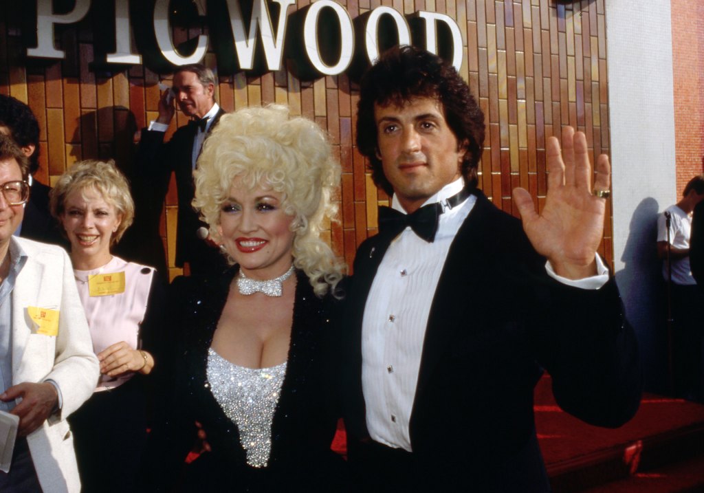 Sylvester Stallone with Dolly Parton at the Rhinestone premiere at the Picwood theater in 1984.