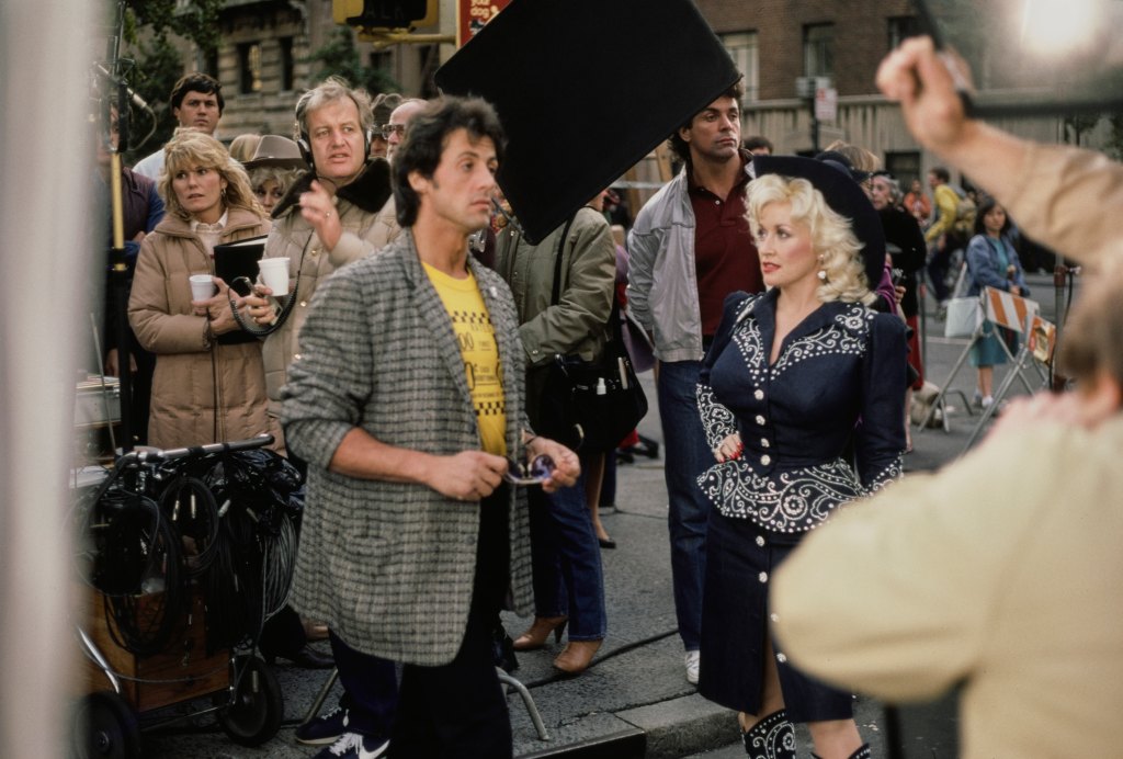 Sylvester Stallone and Dolly Parton during the filming of "Rhinestone", United States, circa 1984. 