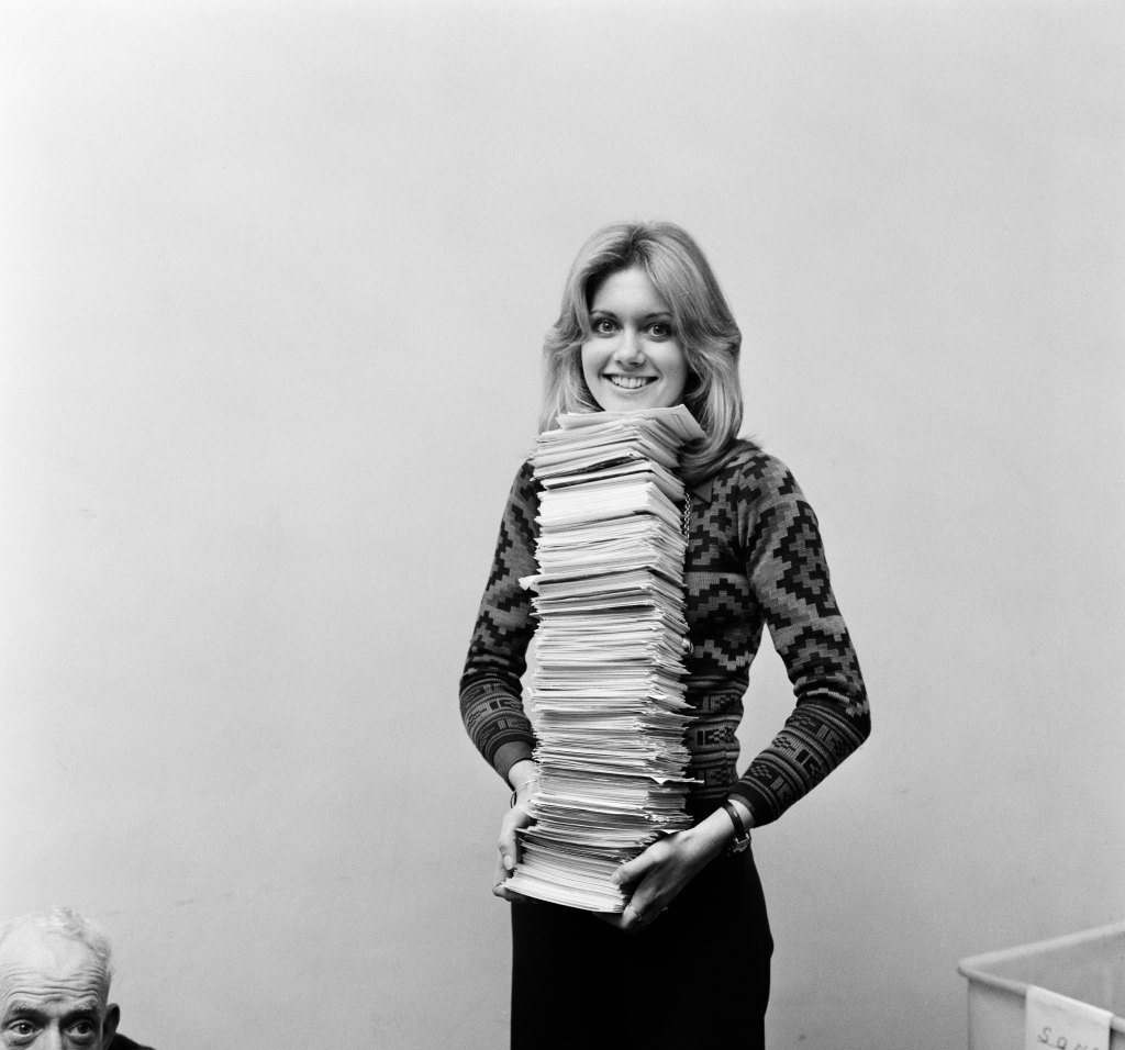 Olivia Newton-John counting votes to see which song viewers had voted for her to sing at the Eurovision Song Contest in Brighton on April 6th. The final count will be completed tomorrow and the result announced by Bill Cotton, Head of BBC TV Light Entertainment on BBC1's "Clunk-Click" on Saturday. 28th February 1974.