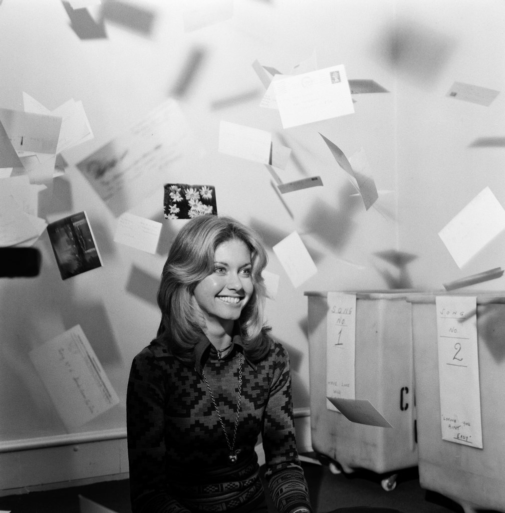 Olivia Newton-John counting votes to see which song viewers had voted for her to sing at the Eurovision Song Contest in Brighton in 1974. 
