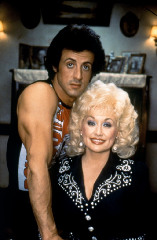  Sylvester Stallone and singer, songwriter and actress Dolly Parton on the set of Rhinestone directed by Bob Clark. 