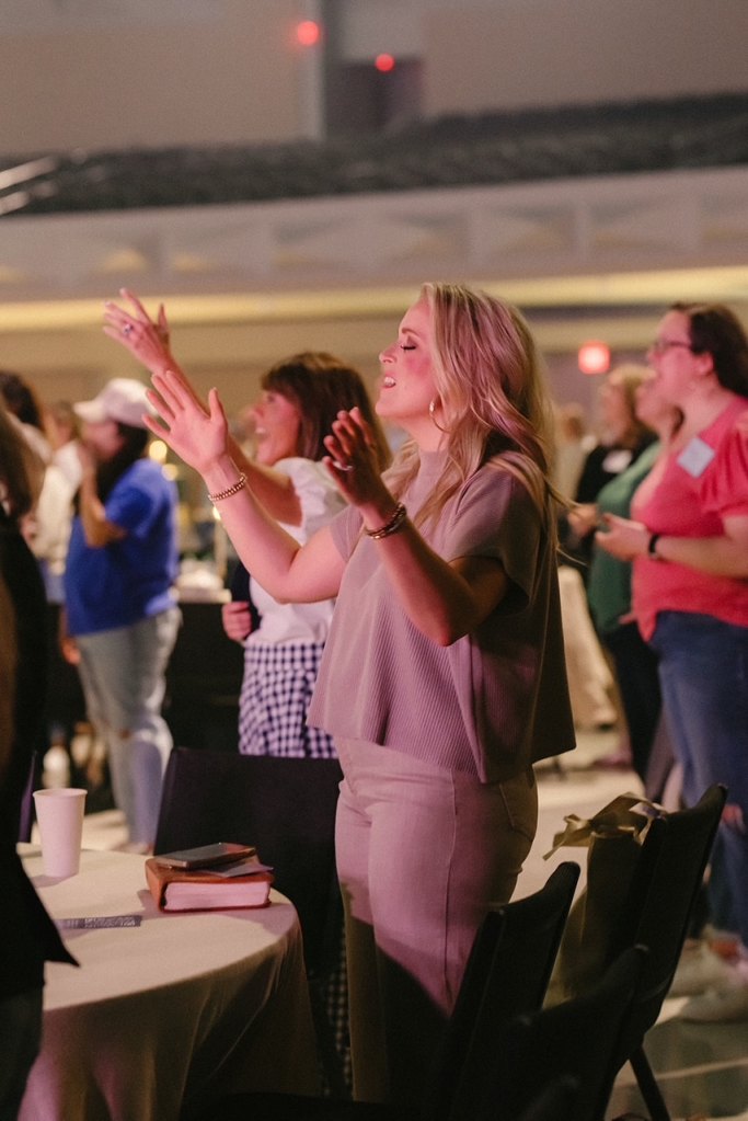 Women worship, share, and encourage each other at each Never Alone Widows retreat